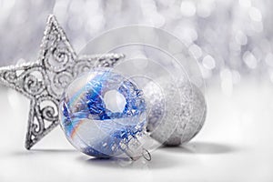 Christmas ornaments on glitter bokeh background
