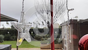 Christmas ornaments on house window