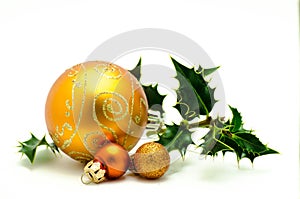Christmas ornaments - orange ball with green holly