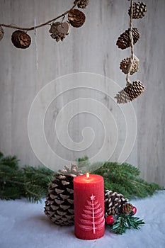 Christmas ornaments with snow, pine tree and candle