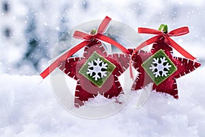 Christmas ornaments in the snow; christmas card with bokeh background and copy space