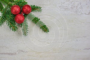 Christmas ornaments on a spruce bough with copy space