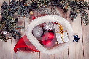 Christmas ornaments on a table in the snow with nice festive background Xmas illuminations