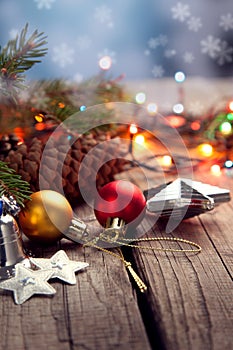 Christmas ornaments on a table in the snow with nice festive background Xmas illuminations