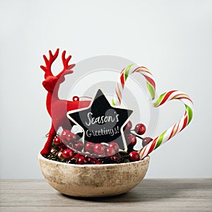 Christmas ornaments and text seasons greetings