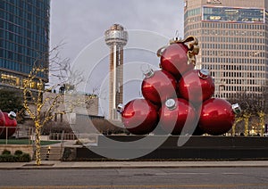 Christmas Ornaments, trees with lights, and the iconic Reunion Tower in downtown Dallas, Texas.
