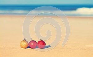 Christmas ornaments on a tropical beach