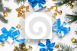 Christmas ornaments. White gift box with blue ribbon, New Year balls and Christmas tree in xmas composition on white background