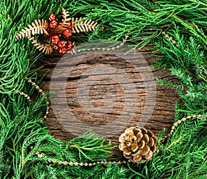 Christmas ornaments on wooden background as frame border with copyspace