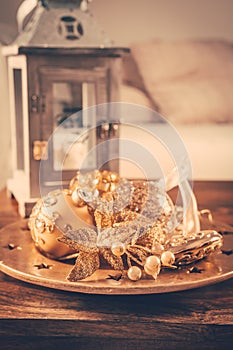 Christmas ornaments on wooden table in cosy home