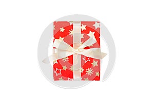 Christmas or other holiday handmade present in red paper with Gold ribbon. Isolated on white background, top view. thanksgiving