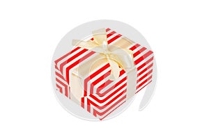 Christmas or other holiday handmade present in red paper with gold ribbon. Isolated on white background, top view. thanksgiving