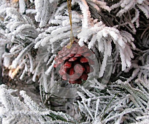 Christmas painted in red color pine cone