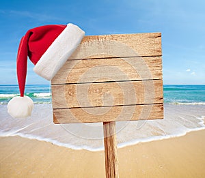 Christmas party on beach signboard as background