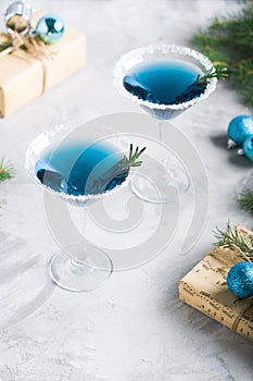 Christmas party composition with drinks gift boxes in blue color