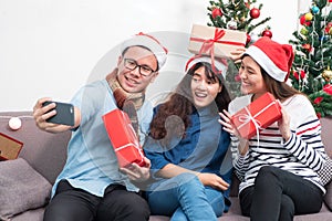 Christmas party with friends, asia woman selfie with smiling face with friends,Holiday celebration concept.