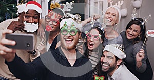 Christmas, party and friends taking a selfie on a phone together with goofy, funny and silly props. Diversity, festive