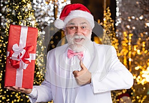 Christmas party. Senior man with beard. Christmas gift. Happy Santa Claus. Joyful present well remembered past. May this