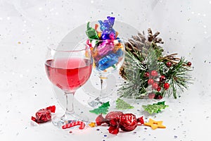 Christmas party table decorations with wine and chocolate sweets