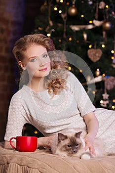 Christmas party, winter holidays woman with cat. New year girl.