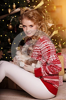 Christmas party, winter holidays woman with cat. New year girl.