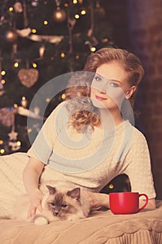 Christmas party, winter holidays woman with cat. New year girl.