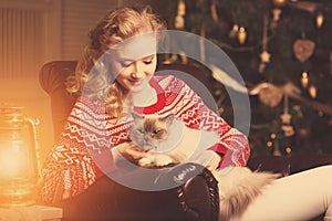 Christmas party, winter holidays woman with cat. New year girl.