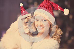 Christmas party, winter holidays woman with cat. New year girl.