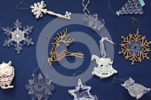 Christmas pattern with beautiful toys. New year decorations on a dark blue background. Top view, flat lay