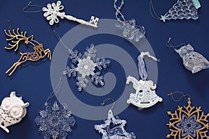 Christmas pattern with beautiful toys. New year decorations on a dark blue background. Top view, flat lay