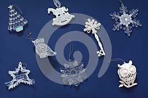 Christmas pattern with beautiful toys. New year decorations on a dark blue background. Top view, flat lay