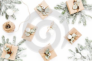 Christmas pattern, texture made in of craft boxes and green branches in the snow. Holiday and celebration concept. Top