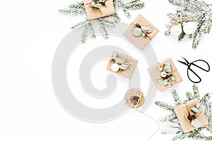 Christmas pattern, texture made in of craft boxes and green branches in the snow. Holiday and celebration concept. Top