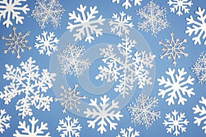 Christmas Pattern white snowflake on blue background. Top view