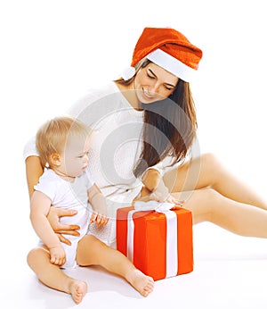 Christmas and people concept - happy mother and child