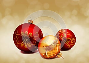 Christmas perfect decoration red and gold yellow balls isolated on golden blurred bokeh background