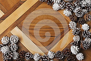 Christmas pine cones on background of parquet