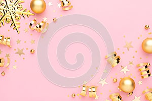 Christmas pink flatly. Many sparkling golden confetti, decorative snowflake and ribbons at pink background. Festive
