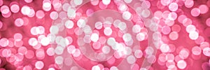 Christmas pink lights background. Bokeh abstract texture. Header of Pinky. Red. Coral. Colorful. Defocused background.
