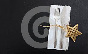 Christmas place setting on black background