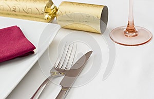 Christmas place setting with gold cracker