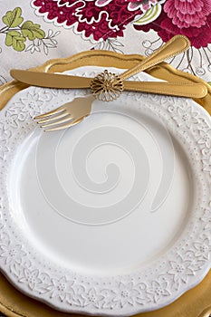 Christmas place setting, gold and flowers