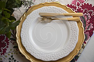 Christmas place setting, gold and flowers
