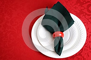 Christmas place setting with green napkin