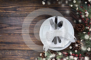 Christmas place setting over a Rustic Wood background