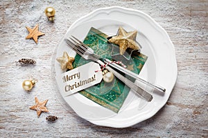 Christmas place setting, plate, napkin, knive and fork photo