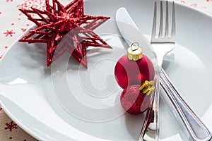 Christmas place setting with red christmas balls