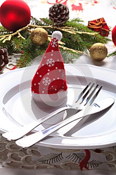 Christmas place setting with ribbon and christmas decorations
