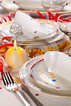 Christmas place setting with ribbon and New Year decorations