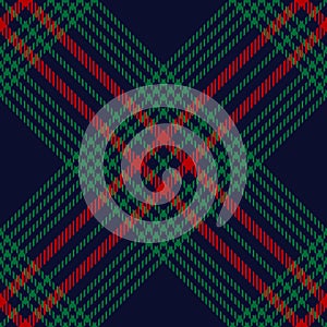 Christmas plaid pattern in blue, red, green. Seamless diagonal hounds tooth tartan check plaid for skirt, blanket, throw.